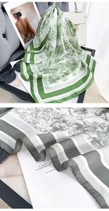 Detail of Toile de Jouy print scarf with elegant striped edges and vintage pattern