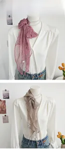 Elegant chiffon neckerchief with checkered rose pattern on a mannequin with pearls