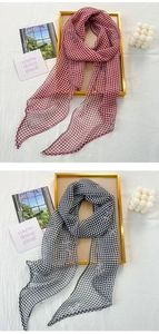 Close-up of elegant chiffon scarves with checkered patterns and rose jacquard details