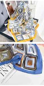 Macro shot of silk scarf fabric showing geometric patterns and smooth texture
