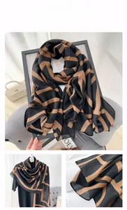 Detail showing soft cotton-linen fabric with geometric black and brown stripes texture