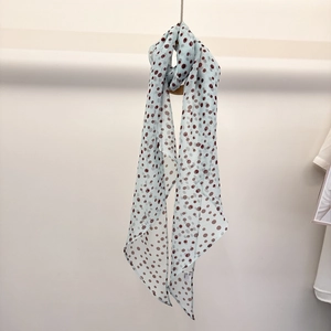 Light blue 100% mulberry silk scarf with reddish-brown polka dots in a long ribbon style