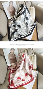 Détail d'un foulard en soie à imprimé floral élégamment drapé sur un sac à main chic