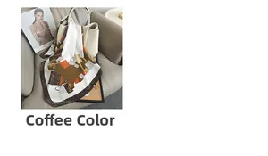Brown leopard print silk scarf draped over a white luxury handbag in a chic setting