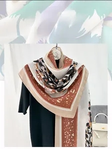 Detail of thin cotton linen shawl featuring leopard print and geometric color blocks
