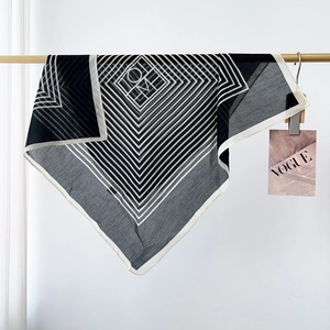 Classic black and white striped silk scarf with geometric pattern and logo detail