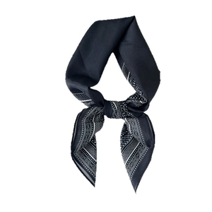 Classic black paisley print silk scarf with white dots and elegant geometric knot detail