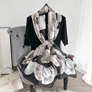 Elegant camellia print silk scarf with black and white abstract patterns for women