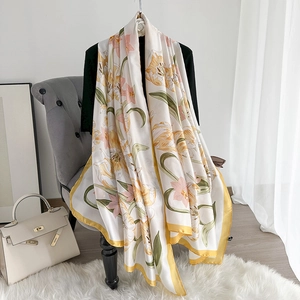 Elegant floral print satin silk scarf with lily pattern and bright yellow border