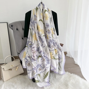 Detailed texture of silk-like floral scarf with purple tulip print in an elegant setting