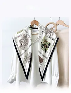 Detail of vintage print scarf in faux velvet fabric styled on white shirt collar