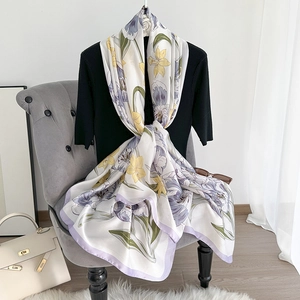 Elegant floral print silk scarf with purple iris patterns and a lightweight silky texture