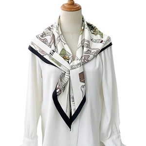 Elegant retro architectural print silk scarf with black border on white blouse display