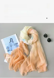 Detail of floral gradient lightweight long scarf with soft airy fabric and artistic print
