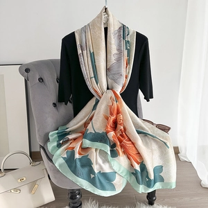 Elegant silk scarf with orange dahlia floral patterns on beige fabric for women