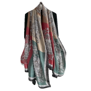 Elegant paisley print silk scarf in deep red and green, lightweight sun protection wrap