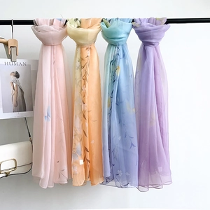 Lightweight sheer floral chiffon scarves in pink, orange, blue, and purple tones