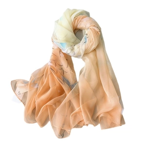 Elegant gradient silk chiffon scarf with yellow, orange, and blue floral leaf patterns