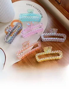 Detailed macro view of 6 large colorful hair claws with sparkling acrylic crystal texture