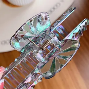 Iridescent large hair claw clip with holographic finish and prism cut design for women