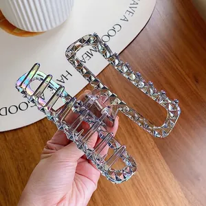 Iridescent crystal-style large acrylic hair claw clip for elegant bun hairstyles