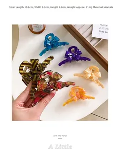 Detail showing acetate hair claw clip dimensions 10.8cm by 5.3cm in various colors