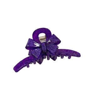 Elegant purple acetate hair claw clip with bow design and geometric grid texture