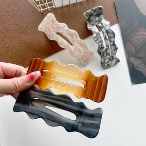 Large acetate wave duckbill hair clip set in amber marble and shell patterns