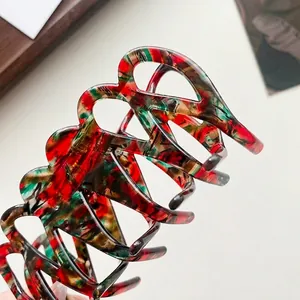 Large acetate hair claw clip with vintage tortoiseshell pattern and high-gloss finish