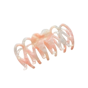 Pink marble pattern acetate hair claw clip with cross-tooth design for elegant styling