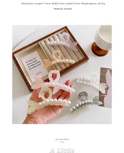 Detail showing fishtail pearl hair claw dimensions 11.6x5.3cm and premium acetate texture