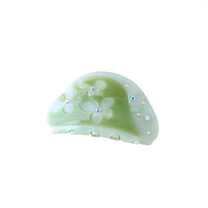 Floral acetate hair claw clip with colorful rhinestones in mint green and cream