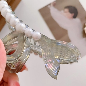 Elegant mermaid tail hair claw with pearly accents and wavy gray resin texture