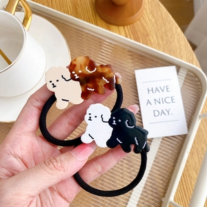 Set of four cute acetate dog hair ties in cream, tortoiseshell, white and black colors