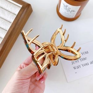 Elegant gold-plated butterfly hair claw clip with tortoiseshell accents for women