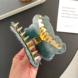 Dark green marble patterned acetate butterfly hair claw clip with gold metal grip mechanism