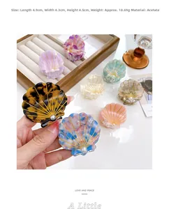 Detailed view of acetic acid shell hair claw with pearl inlay and 4.9cm dimensions