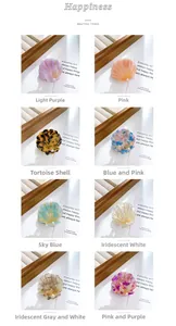Detailed grid view of shell-shaped pearl acetate hair clips in eight assorted colors