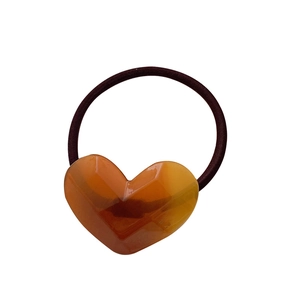 Elastic candy-colored acetate hair tie with amber geometric faceted heart pendant