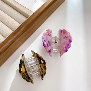 Elegant tortoiseshell and marble texture hair claws with pearl shell accents for women