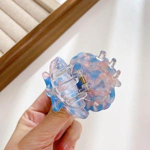 Elegant marble pink and blue acetate shell hair claw clip with a glossy finish