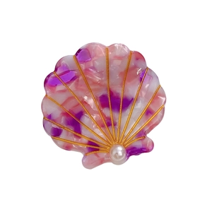 Shell-shaped acetic hair clip with pink marble texture and elegant pearl accent