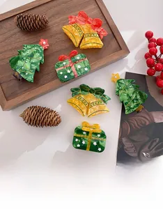 Christmas acetate claw clips with pearls, featuring festive tree and bell designs