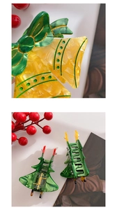 Detail of Christmas bell and tree hair claws with faux pearls and acetate marble texture