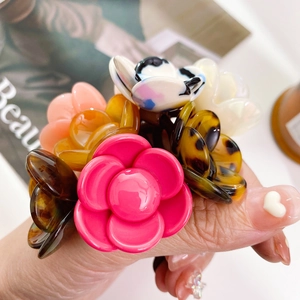 Handheld assorted acetate camellia flower hair ties for women with glossy finish