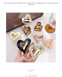 Detailed size view of heart-shaped acetate hair claw clips in various patterns and colors