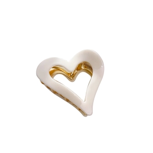 Elegant cream white hollow heart hair claw clip with golden metal spring for women