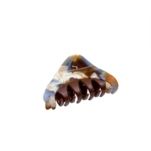 Elegant triangular acetate hair claw clip with marble pattern and multi-tooth grip