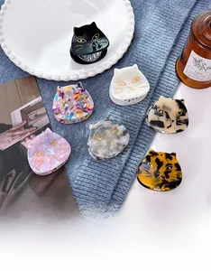 Detailed view of cute acetate cat hair claws in various marble and tortoiseshell patterns