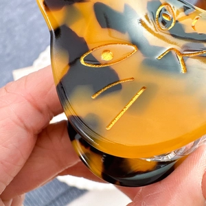 Cute acetate cat hair claw clip with tortoiseshell pattern and golden etched details